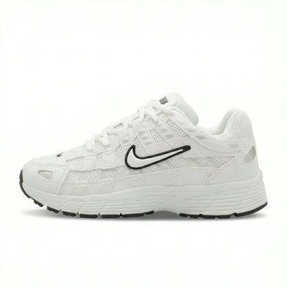 ATLAS. — A lace-up sneaker with layered panels and a raised sole.
