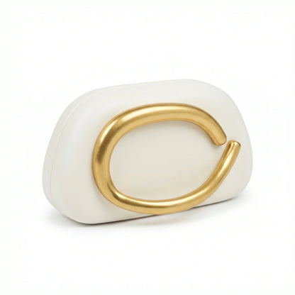 Moonstone — A compact clutch with a rounded shape and oversized ring detail.