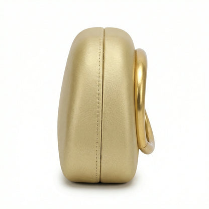 Moonstone — A compact clutch with a rounded shape and oversized ring detail.