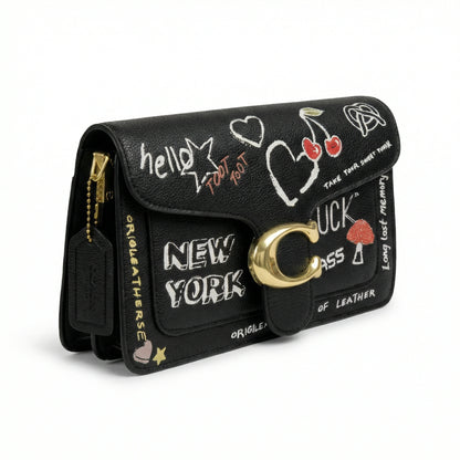 Graphite — A structured shoulder bag with a flap, graphic print and front clasp detail.