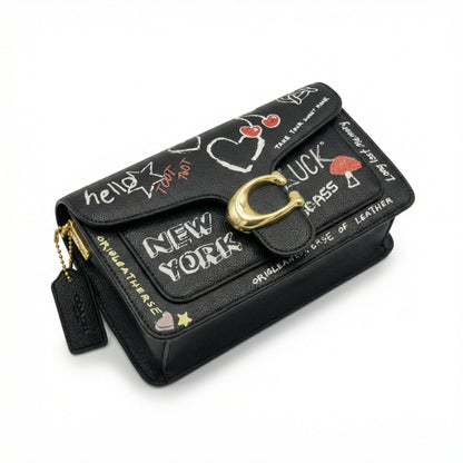 Graphite — A structured shoulder bag with a flap, graphic print and front clasp detail.