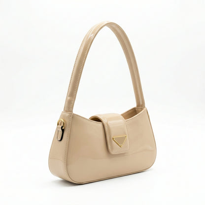 Jet — A curved shoulder bag with a smooth finish and small metal detail.