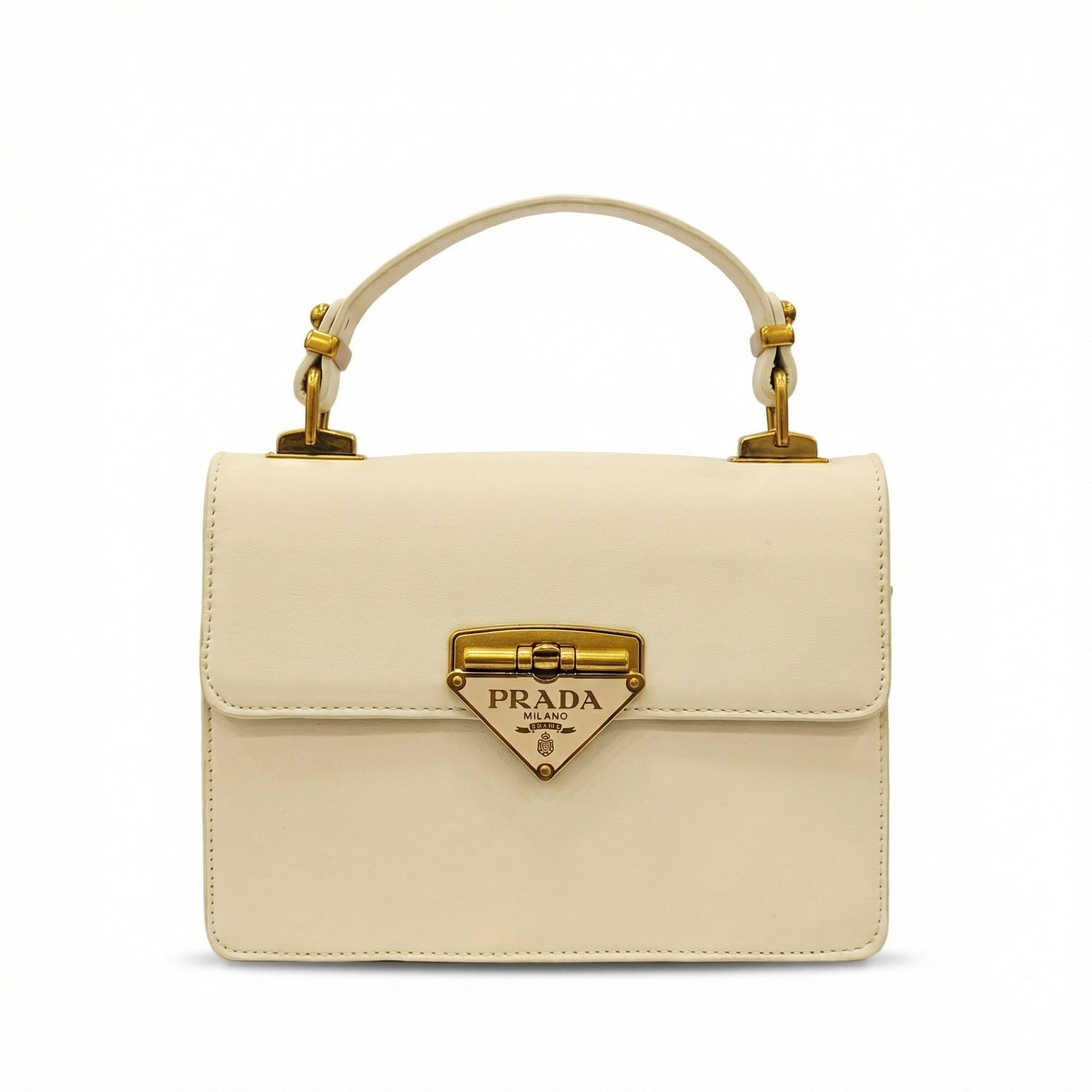 TKN Pearl structured top handle bag featuring triangular gold logo and detachable strap