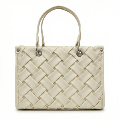 Slate — A top-handle bag with a quilted texture and metal details.