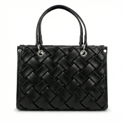 Slate — A top-handle bag with a quilted texture and metal details.