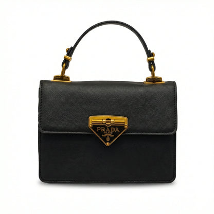Pearl — A structured top-handle bag with a flap and front metal detail.
