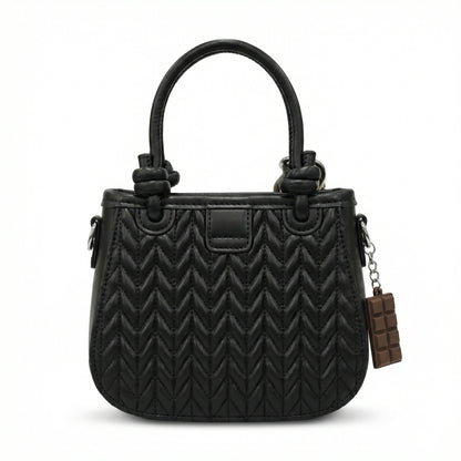 Basalt — A compact crossbody bag with a top handle and wide webbing strap.