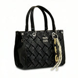 Slate — A top-handle bag with a quilted texture and metal details.