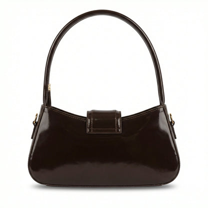 Jet — A curved shoulder bag with a smooth finish and small metal detail.