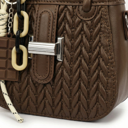 Basalt — A compact crossbody bag with a top handle and wide webbing strap.