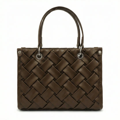 Slate — A top-handle bag with a quilted texture and metal details.
