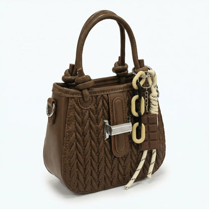 Basalt — A compact crossbody bag with a top handle and wide webbing strap.