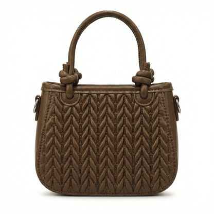 Basalt — A compact crossbody bag with a top handle and wide webbing strap.