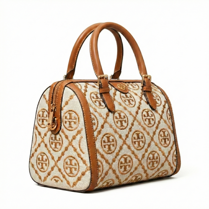 Legacy — A structured Boston bag with rounded top handles and an all-over pattern.
