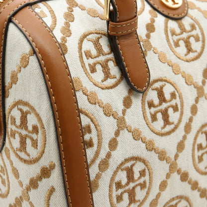 Legacy — A structured Boston bag with rounded top handles and an all-over pattern.