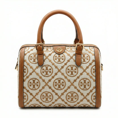 Legacy — A structured Boston bag with rounded top handles and an all-over pattern.