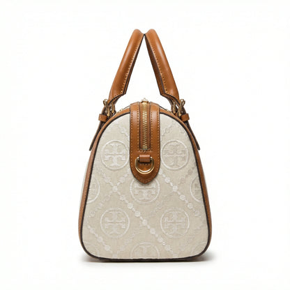 Legacy — A structured Boston bag with rounded top handles and an all-over pattern.