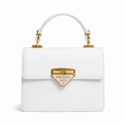 Pearl — A structured top-handle bag with a flap and front metal detail.