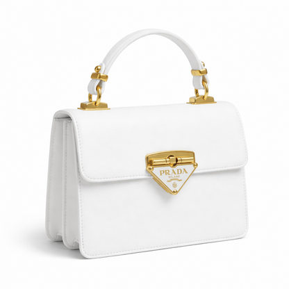 Pearl — A structured top-handle bag with a flap and front metal detail.