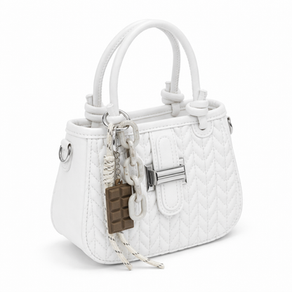 Basalt — A compact crossbody bag with a top handle and wide webbing strap.