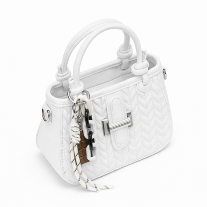 Basalt — A compact crossbody bag with a top handle and wide webbing strap.