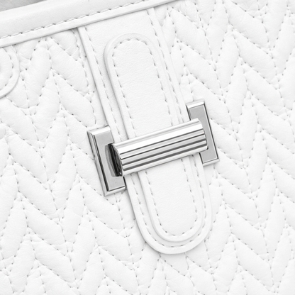 Basalt — A compact crossbody bag with a top handle and wide webbing strap.