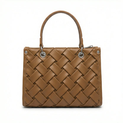 Slate — A top-handle bag with a quilted texture and metal details.