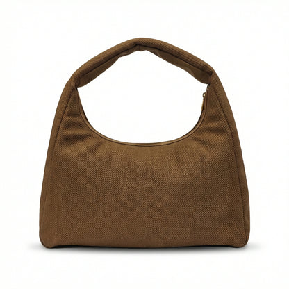 Eclipse — A curved shoulder bag with a textured finish and small metal detail.