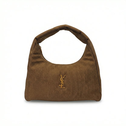Eclipse — A curved shoulder bag with a textured finish and small metal detail.