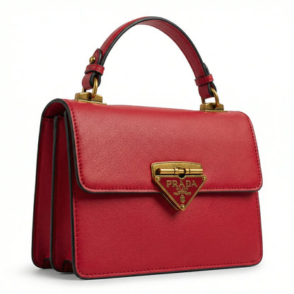 Pearl — A structured top-handle bag with a flap and front metal detail.