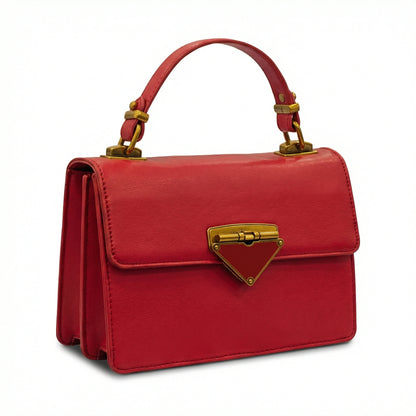 Pearl — A structured top-handle bag with a flap and front metal detail.