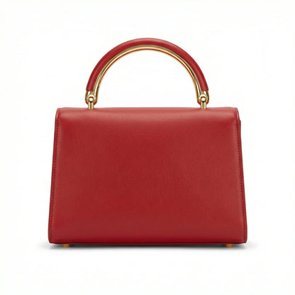 Pearl — A structured top-handle bag with a flap and front metal detail.