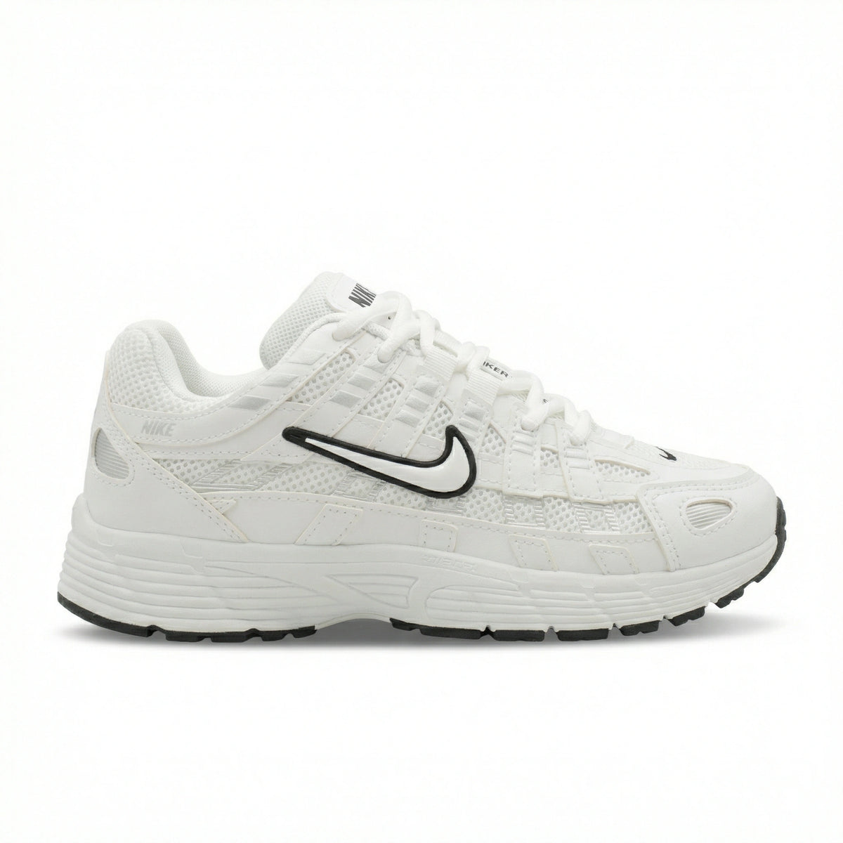 ATLAS. — A lace-up sneaker with layered panels and a raised sole.