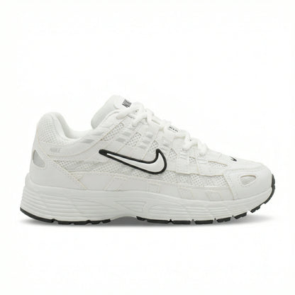 ATLAS. — A lace-up sneaker with layered panels and a raised sole.