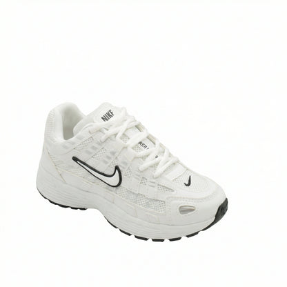 ATLAS. — A lace-up sneaker with layered panels and a raised sole.