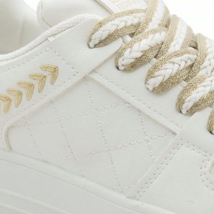 Drift — A low-profile lace-up sneaker with stitched panel details.