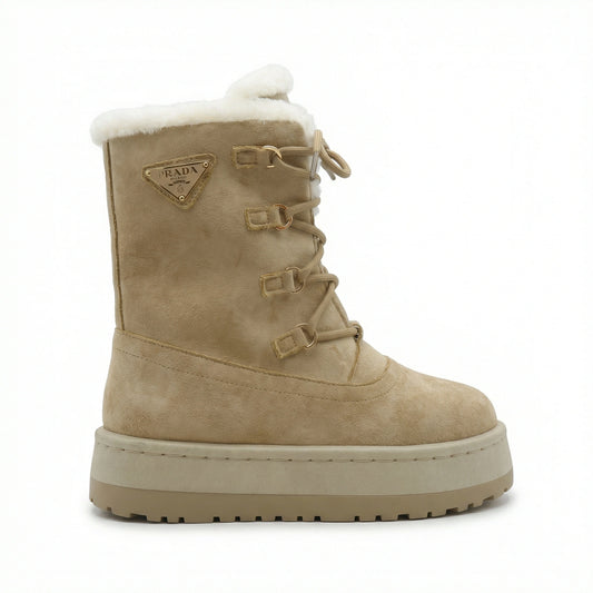 TKN Aspen silhouette in Cognac brown featuring a high-profile lace-up design and white plush shearling collar
