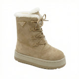 Aspen — A lace-up boot with a tall shaft, plush-look collar and platform sole.