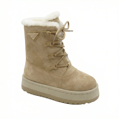 Aspen — A lace-up boot with a tall shaft, plush-look collar and platform sole.