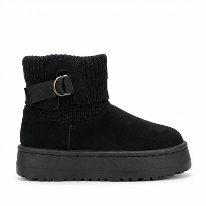 Velvet Touch — A boot with a knitted cuff, buckle detail and platform sole.