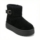 Velvet Touch — A boot with a knitted cuff, buckle detail and platform sole.