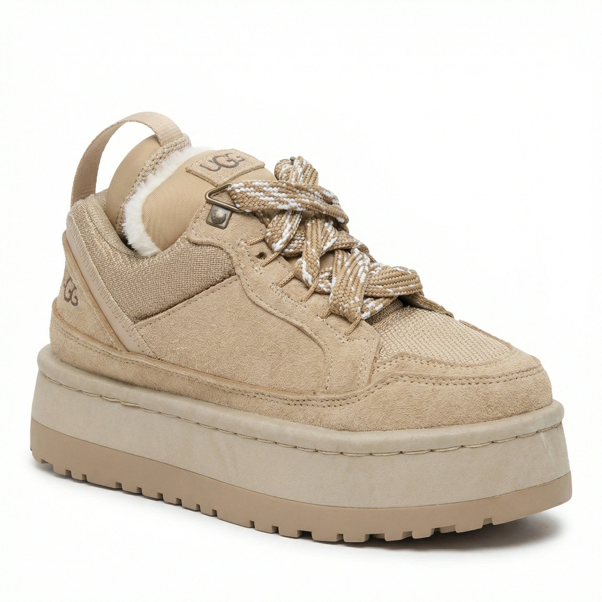 Close-up of TKN Dune Platform showing technical rope laces, metallic hardware, and plush shearling lining