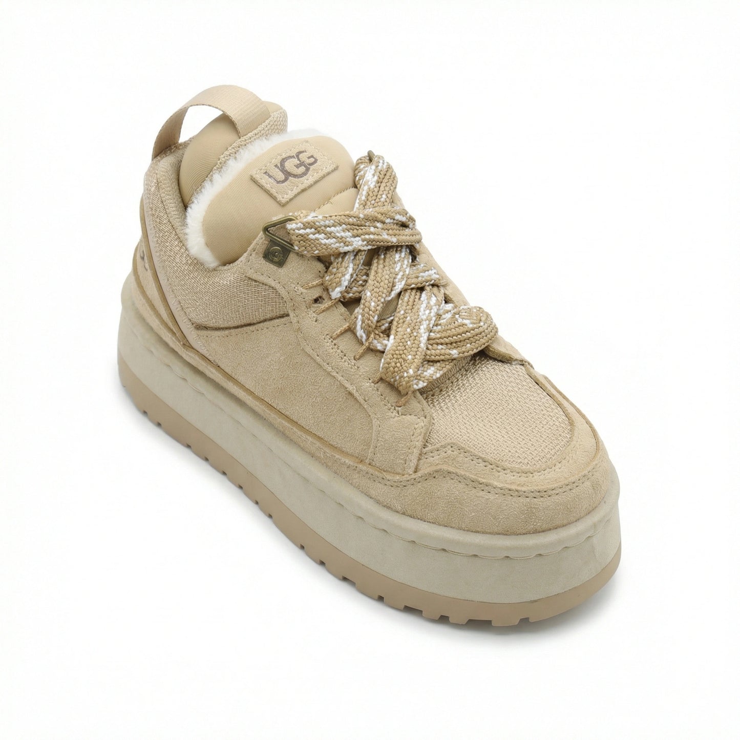 Close-up of TKN Dune Platform showing technical rope laces, metallic hardware, and plush shearling lining