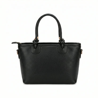 Onyx — A structured tote with knotted top handles and metal-tone details.