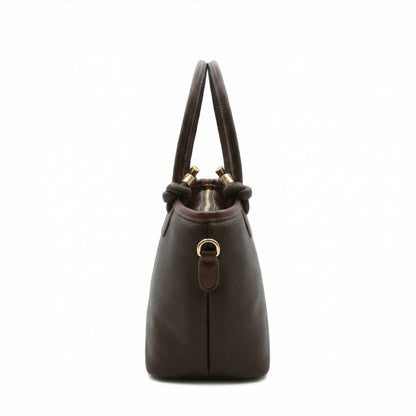 Onyx — A structured tote with knotted top handles and metal-tone details.