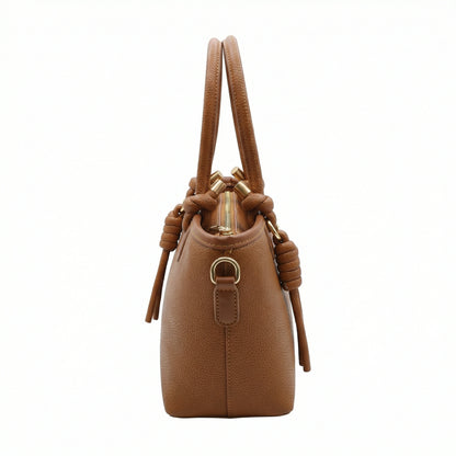 Onyx — A structured tote with knotted top handles and metal-tone details.