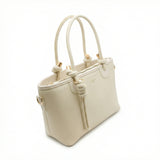 Onyx — A structured tote with knotted top handles and metal-tone details.