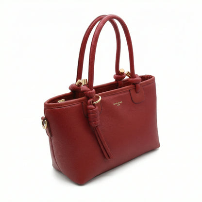 Onyx — A structured tote with knotted top handles and metal-tone details.