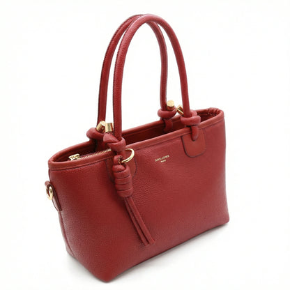 Onyx — A structured tote with knotted top handles and metal-tone details.