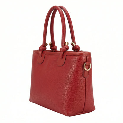Onyx — A structured tote with knotted top handles and metal-tone details.